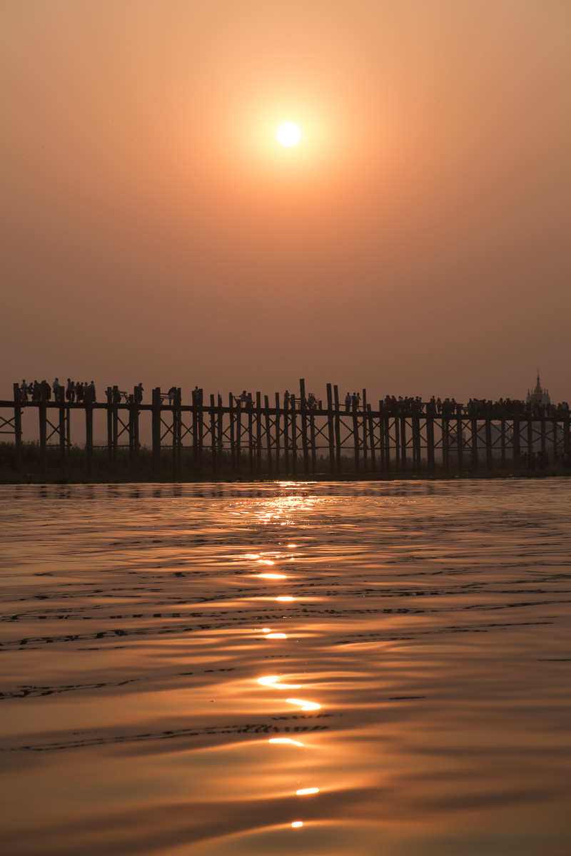 U bein bridge boat sunset
